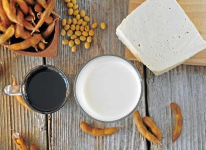 Soybean milk, sauce and tofu on a wooden table